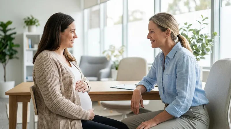 Pregnant woman talking calmly with her doctor about alcohol during pregnancy